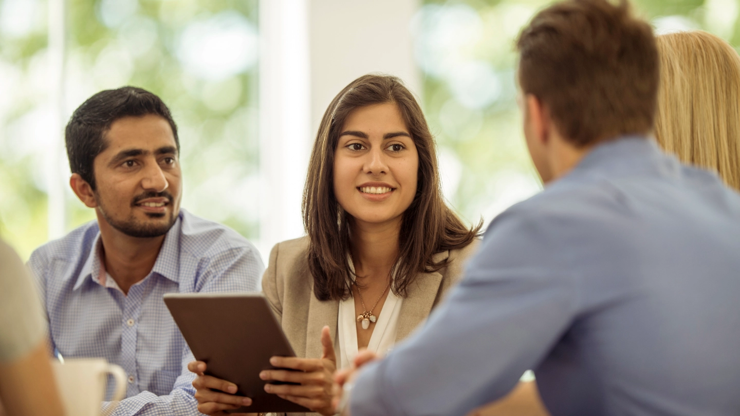 men and woman in a meeting image