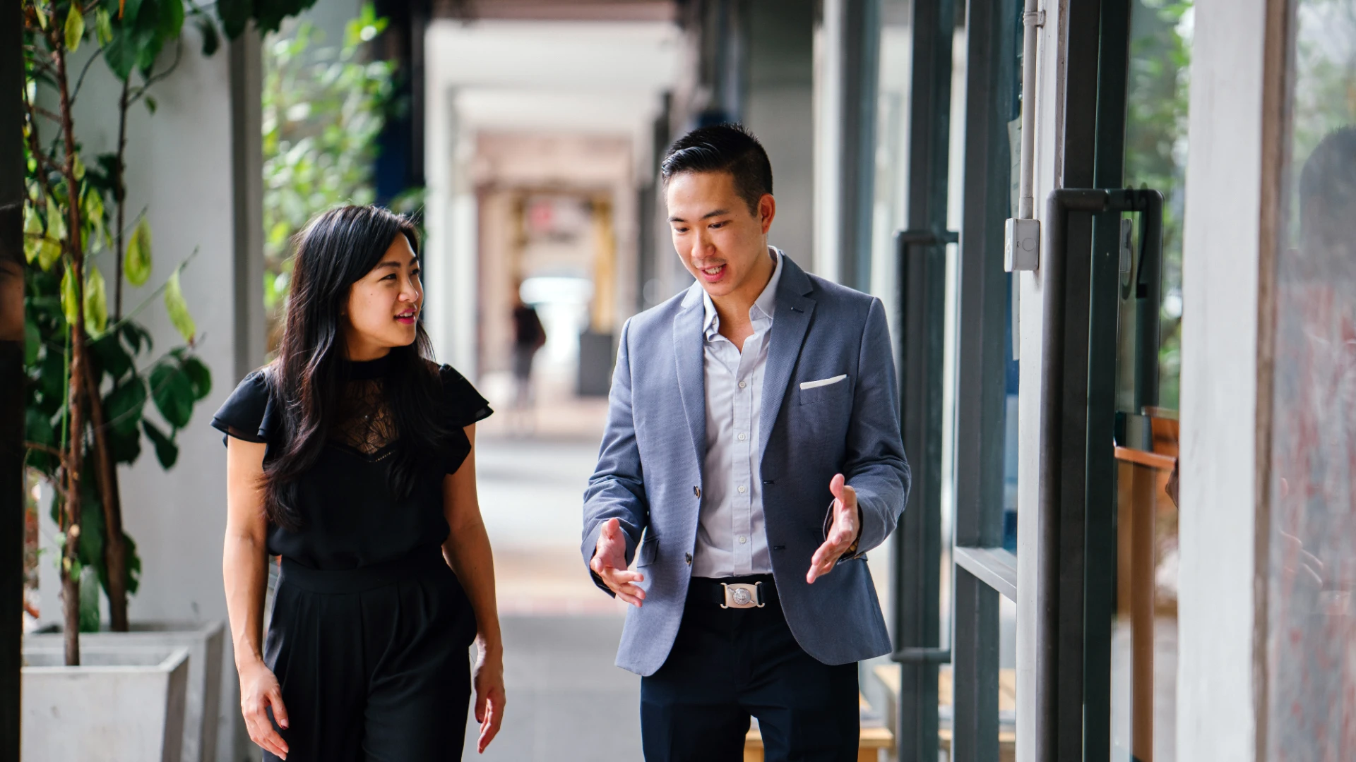 Two Professional Business People Walking